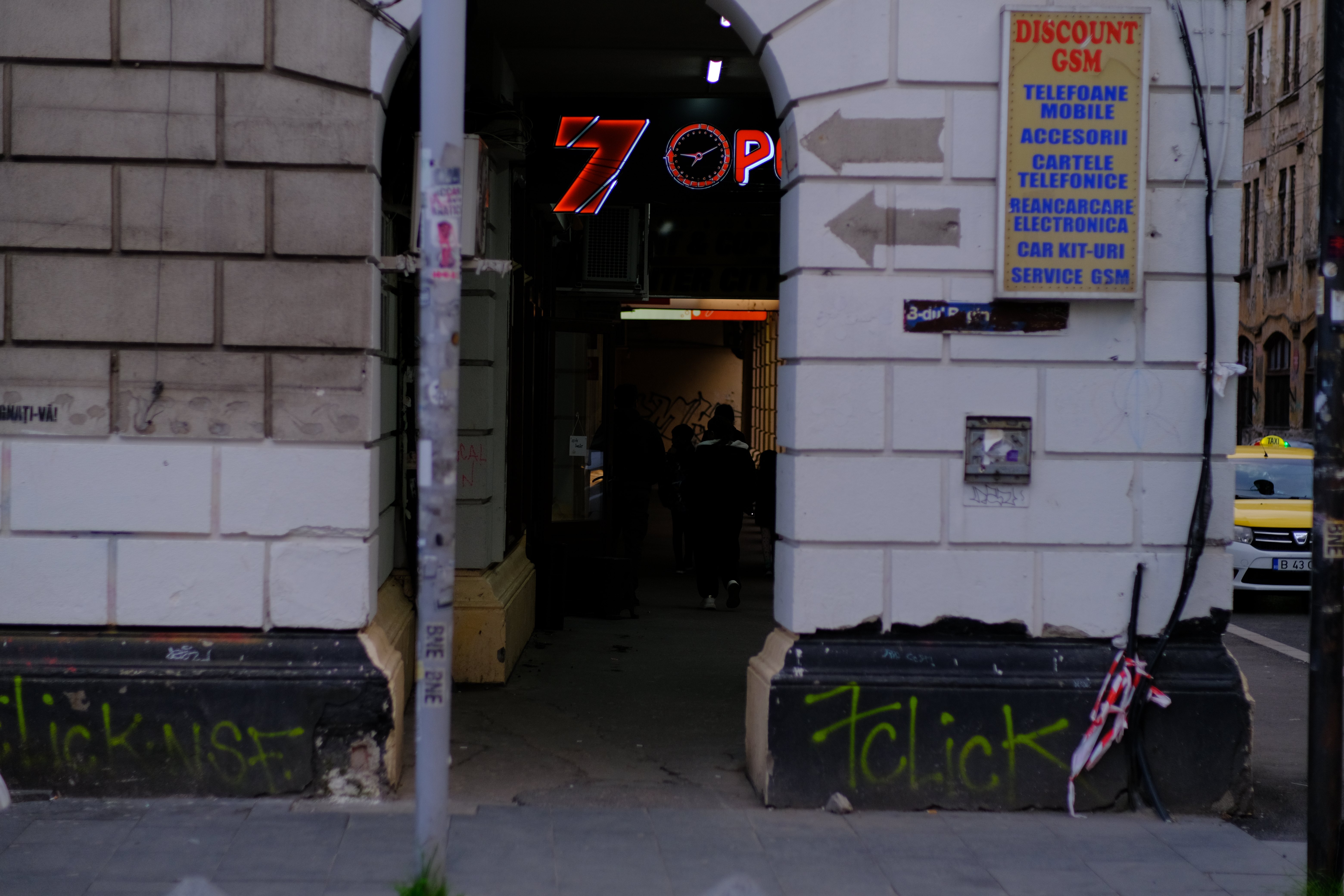 Building entrance with graffiti
