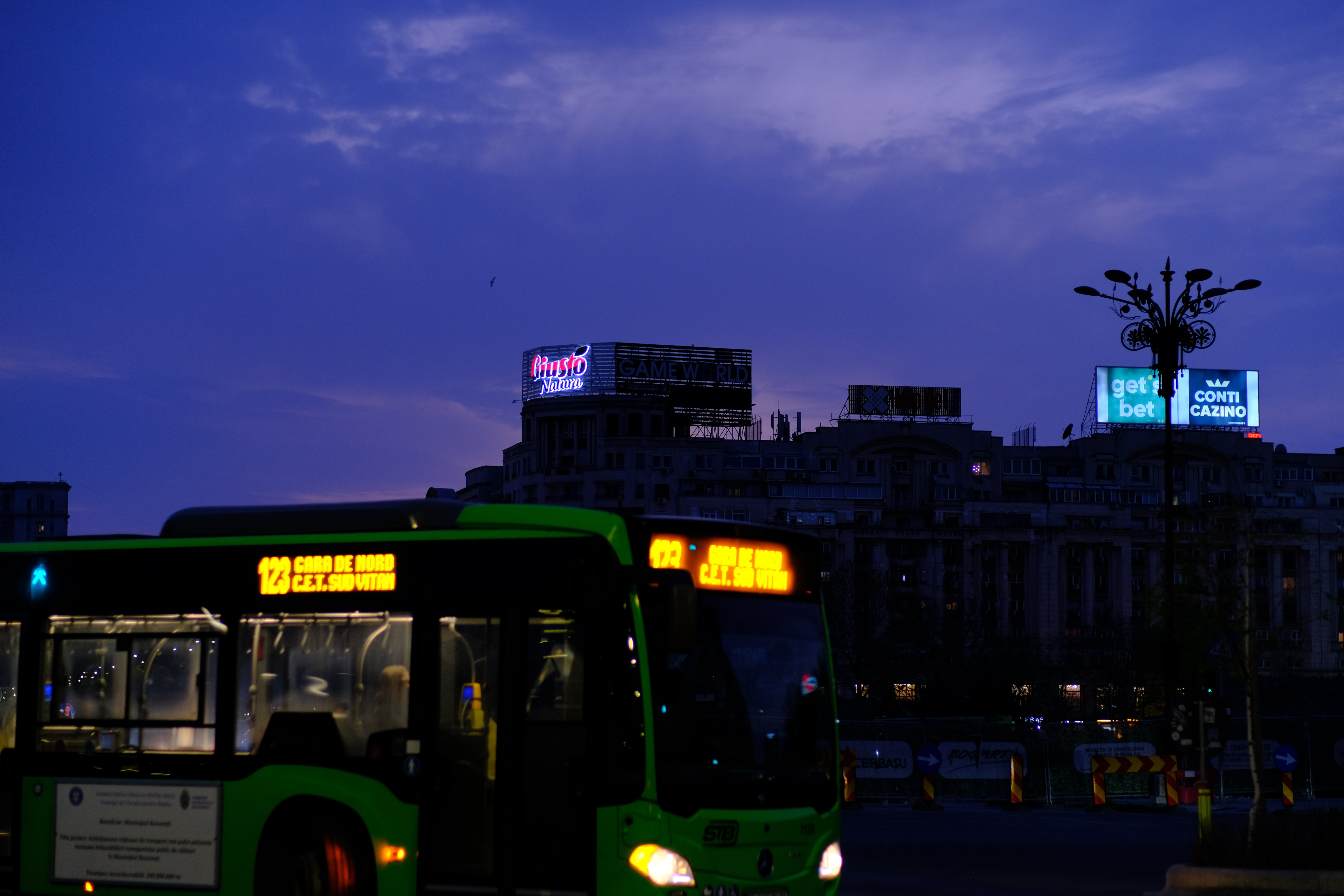 Green bus at twilight
